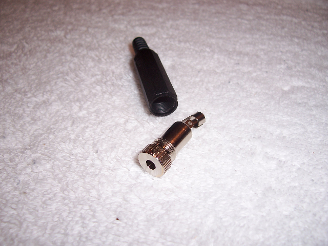 A two-piece, screw-together audio jack.