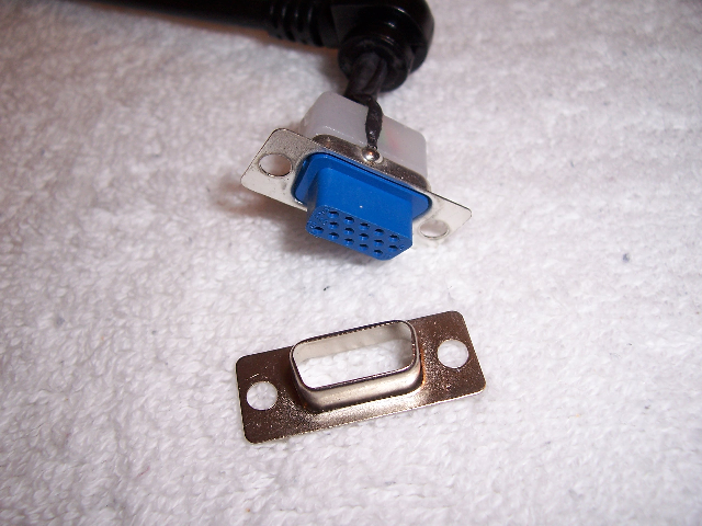A VGA extension cable with the plastic shroud broken off one end.