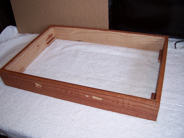 The box (not yet glued together) with one coat of stain.